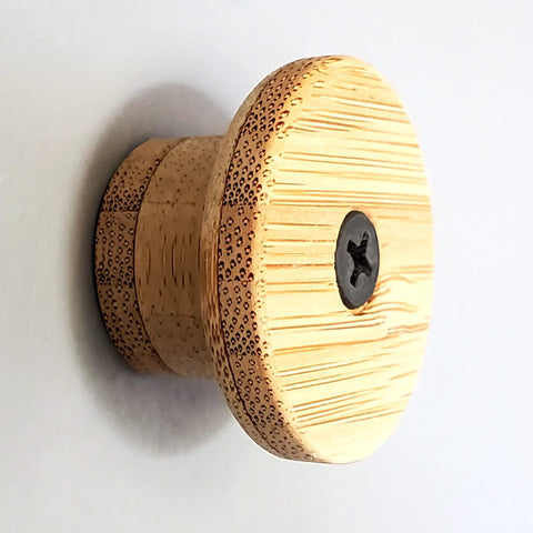 Bamboo flush mount knob for ski wall mount rack, secure flat storage, eco-friendly material, minimalist design.