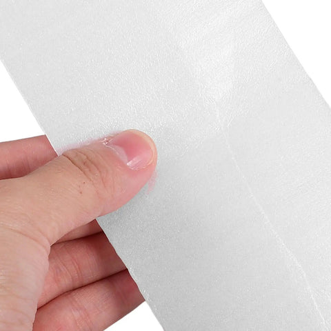 Close-up of hand holding 100 Pack White EPE Packing Bags for Glassware Protection and Fragile Items, Soft Cushioning Sleeves