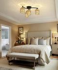 Four Light Crystal Flush Mount Ceiling Light in black and gold with crystal shades illuminating a modern farmhouse bedroom setting.