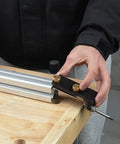 Dead Nuts Accurate Aluminum Profile Tapping Aid Tool positioning on a wooden surface for precise drilling on aluminum extrusions.