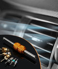56 Piece R134a R12 AC Valve Core Kit with Quick Remover in front of car air vent, showing brass and multicolored valve cores