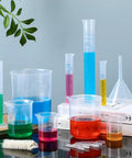 16 Piece Plastic Chemistry Lab Kit With Graduated Cylinders And Beakers, Pipettes, Funnel And Brush on table setup.