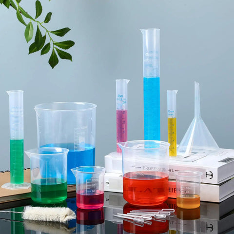16 Piece Plastic Chemistry Lab Kit With Graduated Cylinders And Beakers, Pipettes, Funnel And Brush on table setup.