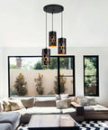 Living room with 3 Light Modern Kitchen Island Pendant Lights With Cylindrical Metal Cage, Industrial Round Base Multi Pendant Fixture.