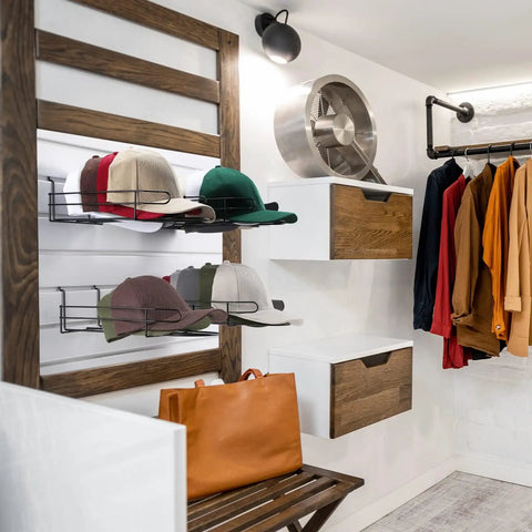 Four Piece Metal Hat Display Racks For Slat Wall Measuring 13 By 7.9 By 3.8 Inches showcasing baseball hats in a closet