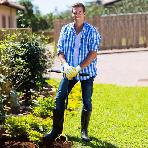 Person using Manual Twist Tiller For Gardening With Seventeen Inch Arc Handle And Ergonomic Grip Garden Claw Cultivator outdoors