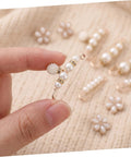 Eight Piece Pearl Waist Tightener Pins With Secure Locking Buckle System Fixes Loose Jeans And Skirts Instantly No Sew Hidden Dress Clips in hand.