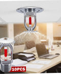 10 Pack Copper Fire Sprinkler Heads 155 Degree Activation Half Inch Thread Vertical Spray in action, spraying water downward in office.