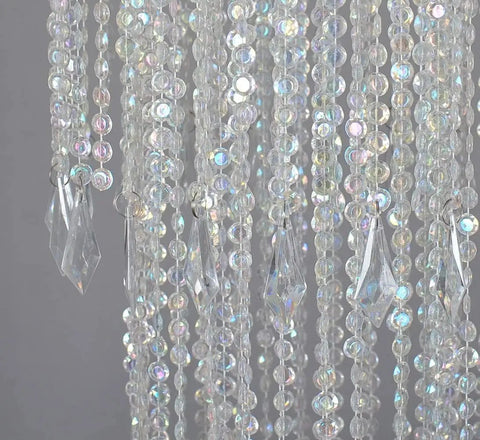 Close-up of the Three Tier Sparkling Iridescent Acrylic Beaded Hanging Chandelier With Diamond Cut Beads showcasing crystal pendants.