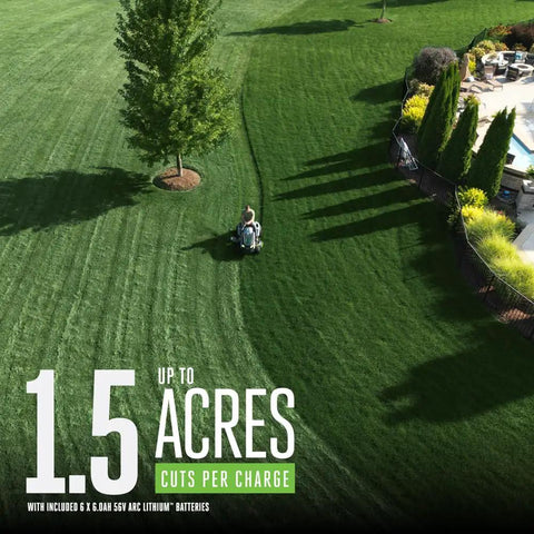Person using Electric Riding Lawn Mower 42-Inch Deck Cordless Tractor With Six 56V 6.0Ah Batteries on large green lawn