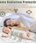 Mother and baby sleeping under EMF protective shield promoting home radiation protection.