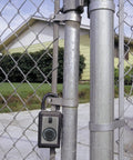 Three Key Portable Spin Dial Key Safe Lock Box in Titanium Gray on chain-link fence for real estate and construction use