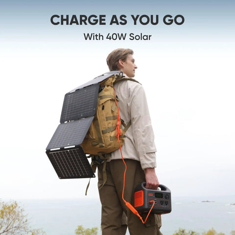 Person hiking with Beast Portable Solar Generator Explorer 300 Power Station 292Wh With 40W Solar Panel for outdoor charging