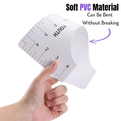 Hand holding youth size ruler from T Shirt Alignment Ruler Kit For Vinyl Designs 4 Piece PVC Ruler Set For Centering Graphics On T Shirts Heat Press Accessories Includes Adult Youth Toddler And Infant Sizes Durable Reusable, highlighting flexibility.