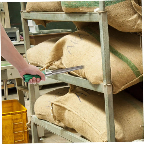 Stainless Steel Grain Sampler Tool With Handy Handle Compact Probe in use sampling grains from burlap sacks on metal shelving