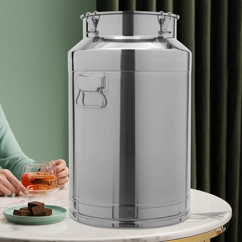 Built Tough Stainless Steel Food Storage Container With Airtight Silicone Seals And Secure Locking Clamps For Kitchen Pantry Organization And Keeping Rice Grains Fresh 12 Liter on a table next to a drink.
