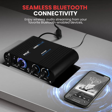 Wireless Bluetooth Home Audio Amp With 90W Dual Channel Power on a table, smartphone nearby showing streaming capability.