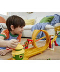Child playing with Mario Kart Track Set And Die Cast Toy Car Jungle Kingdom Raceway With Waterfall Jump Over 3 Feet Tall.