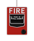 Fire alarm pull station on red wall panel with black pull-down lever and PUSH IN PULL DOWN label