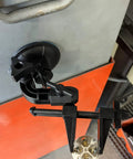 Kickass Vacuum Bench Vise For Smooth Workbenches With No Sweat Clamping Mechanism Featuring Low Key Tilt Rotate Knobs Beefy Grooved Jaws Perfect For Delicate Hobby Crafts And Circuit Repair Black mounted on a workbench with a suction base.