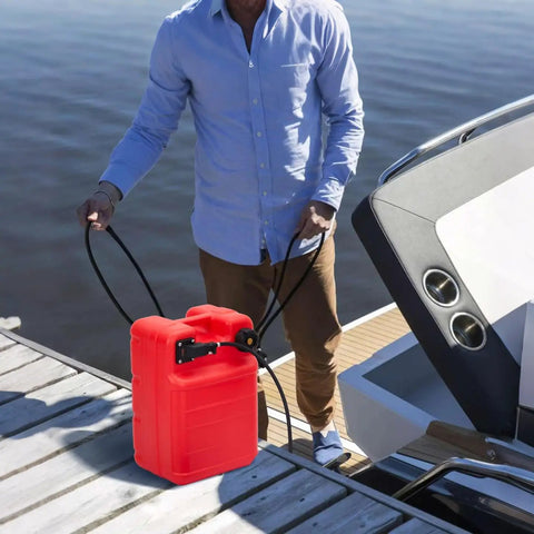 Man carrying Portable 6 Gallon 24L Marine Fuel Tank With 9.8 Foot Hose Level Gauge And L Shaped Handle on a dock near boat