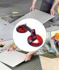 Heavy Duty Metal Vacuum Suction Cup Lifter For Glass And Tile Packs A Badass Double Claw Grip used for placing tiles on a floor.
