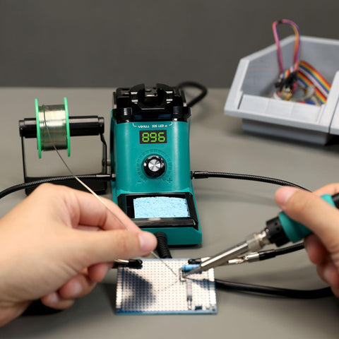 Hands using Soldering Iron Station Kit With 60W Soldering Iron, PID Temperature Control, ESD Safe, 12-In-1 Helping Hands, Solder Dispenser