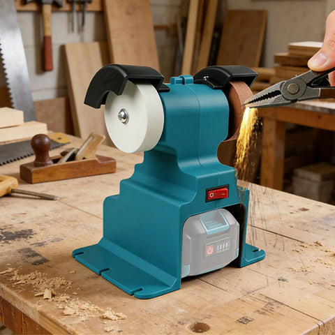 Get Your Hands on This Badass Cordless Mini Bench Grinder with two wheels and a Makita battery on a workbench.