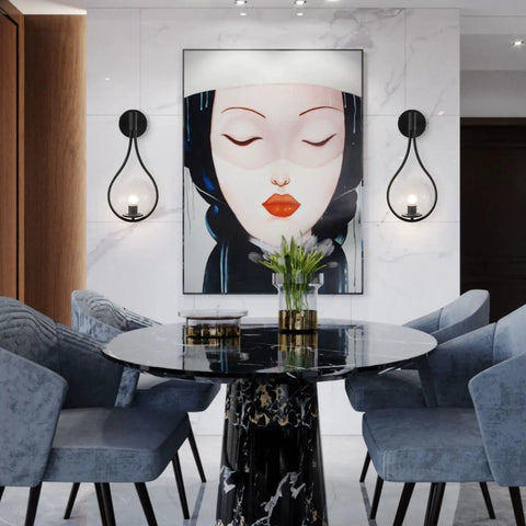 Industrial Vintage Matte Black Globe Wall Sconce Set of 2 With Clear Hand Blown Glass Shades beside art in dining room