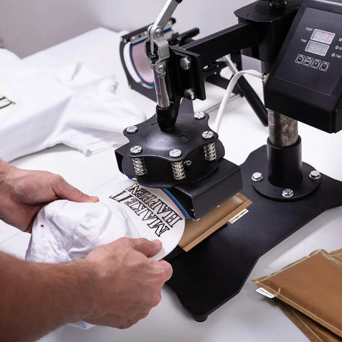 Using Heat Press Pillow Bundle with Five Size Mats Teflon Pillows for Sublimation on a white garment