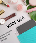 Minty blue bubble mailer with cosmetics, watch, and greenery nearby, showcasing versatility for 40 Pack 8.5 By 12 Inch Outer Bubble Mailers With 8.5 By 11 Inch Inner Cushioned Envelopes Waterproof Self Seal Adhesive Shipping Bags In Minty Blue Bright Color For Small Business.