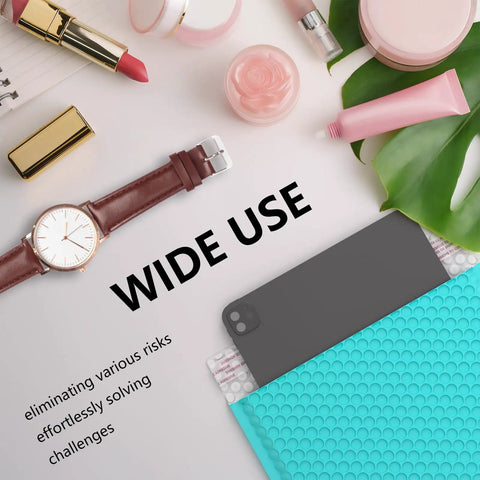 Minty blue bubble mailer with cosmetics, watch, and greenery nearby, showcasing versatility for 40 Pack 8.5 By 12 Inch Outer Bubble Mailers With 8.5 By 11 Inch Inner Cushioned Envelopes Waterproof Self Seal Adhesive Shipping Bags In Minty Blue Bright Color For Small Business.