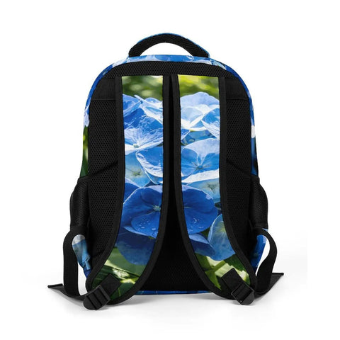Back view of spacious unisex backpack with blue hydrangea print, breathable straps, polyester material for school, work, travel and everyday use.