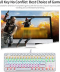 Killer Mechanical Gaming Keyboard With 107 Keys Wired Blue Switches Hella Smooth Typing And Dope Dynamic Backlight Tough Metal Frame Built For PC And Mac Players To Dominate Every Match, with colorful backlight and gaming setup.