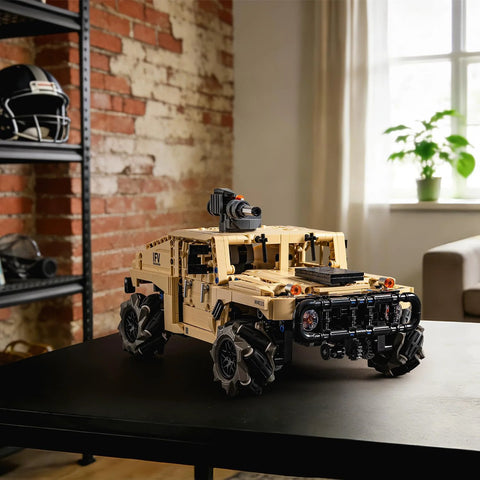 technic RC Hummer kit assembled on a table in a room with a brick wall, showcasing its military-style design and detailed build.