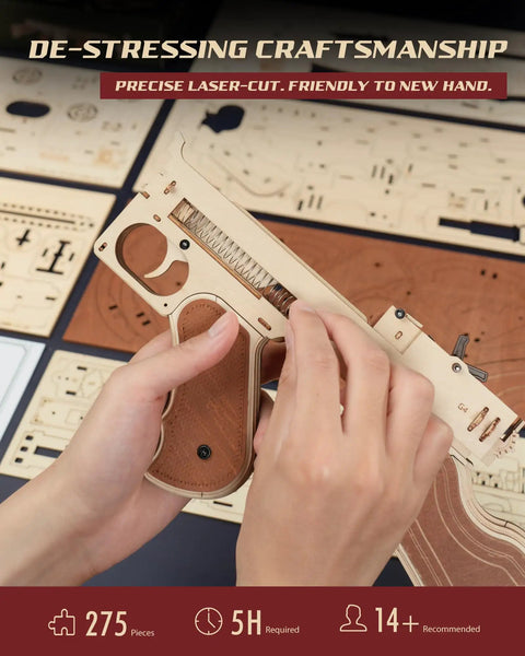 Hands assembling 3D Wooden Puzzle Kit For Adults 275 Pieces Submachine Shooter With Rubber Band Firing model, laser-cut pieces.
