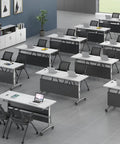 Game Changer Folding Mobile Conference Table With Privacy Panel And Heavy Duty Locking Casters Flexible Workstation Setup For Home Office Or Classroom Use In Packs Of Four Tables in a modern classroom layout with laptops.