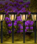 Solar Yard Light 4 Pack Outdoor Lantern Style Pathway Lights Waterproof With Vintage Filament COB Bulbs among purple flowers