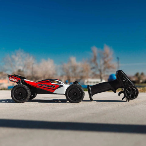 Side view of GROM 4x4 Smart Small Scale RC Buggy RTR With Battery And Smart Charger Red White High Traction All Terrain Electric RC Car