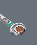 Close-up of Joker Ratcheting Combination Set open-end hold function gripping a rusted fastener securely