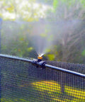 Brass Misting Nozzle Replacement Heads 0.2mm Orifice 10/24 UNC Outdoor Cooling System on net emitting fine mist.