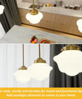 Top view of a set of 2 teardrop crystal pendant lights in a modern kitchen setup, gold finish, showcasing LED fixtures