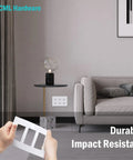 Person holding 3 Gang Screwless Decorator Wall Plates 2 Pack Slick Flush Mount Light Switch Covers with hidden screws, living room scene