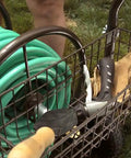 Heavy Duty Four Wheel Hose Reel Cart With 250 Foot Capacity, Steel Frame, Built In Garden Basket in use on lawn