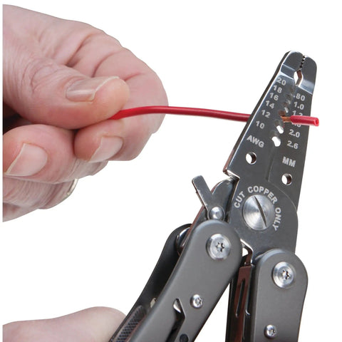 Close-up of hand using 13-In-1 Electrician Multi-Tool For Wiring Projects With Wire Strippers, Long Nose Pliers, And Cutters, cutting wire.