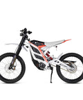 Kickass Powerful 8000W Peak 72V Electric Dirt Bike For Adults, Ripping Through Trails At 60 MPH, Smooth Ride On 75 Mile Range, Beefy 19 Inch Fat Tires, Hydraulic Suspension Setup side view showcasing the lightweight aluminum frame and beefy tires.