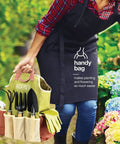 Gardener holding 10 Piece Garden Tools Set With Heavy Duty Hand Tools And Fashion Tote Bag For Women Ergonomic Handles Includes Weeder Transplanter Trowel Pruner Rake Fork Gloves And Spray Bottle Durable Garden Kit Gift For Her