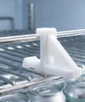 White plastic Ten Pack Refrigerator Shelf Support Clips And Freezer Bracket Set For Steady Fridge Shelves clipped on a metal rack