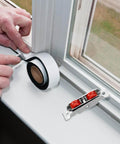 Man installing Stainless Steel Sliding Door Wheel Replacement Kit With Dual Nylon Wheels And Integrated Ball Bearings near window