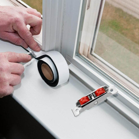 Man installing Stainless Steel Sliding Door Wheel Replacement Kit With Dual Nylon Wheels And Integrated Ball Bearings near window
